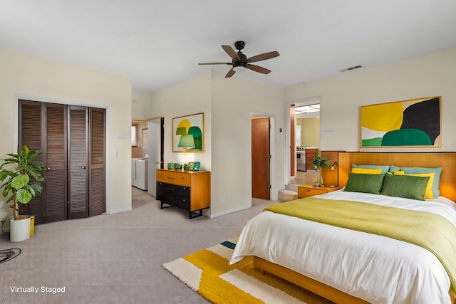 bedroom featuring light colored carpet, separate washer and dryer, a ceiling fan, visible vents, and a closet