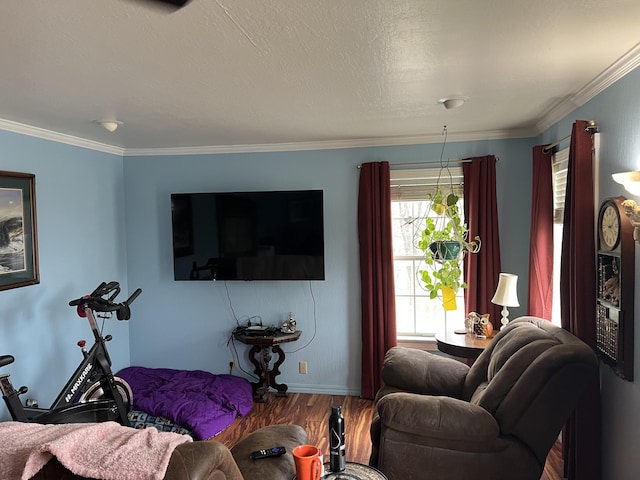 living area featuring a textured ceiling, wood finished floors, and crown molding