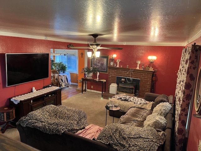 carpeted living area featuring a textured ceiling, a textured wall, a ceiling fan, and crown molding