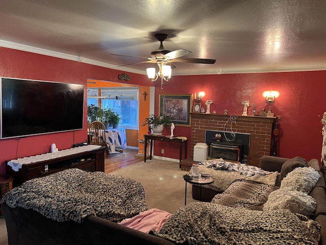 living room with a textured ceiling, a ceiling fan, crown molding, and a textured wall