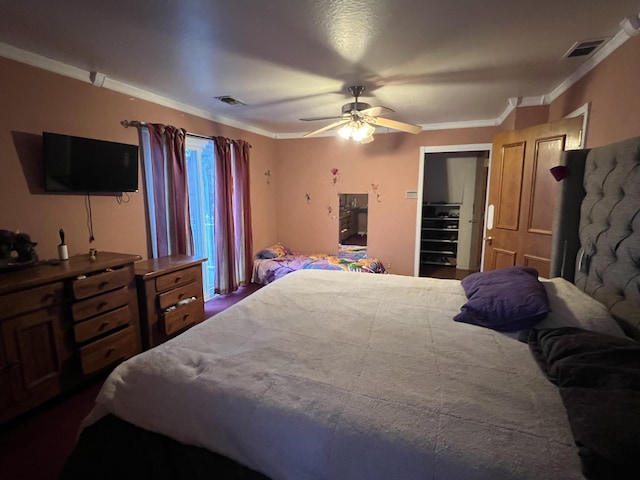 bedroom featuring visible vents, crown molding, and ceiling fan