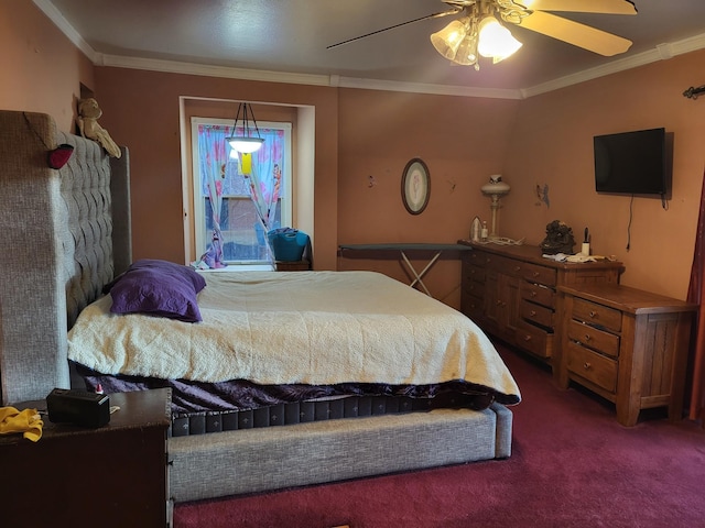 carpeted bedroom with a ceiling fan and crown molding