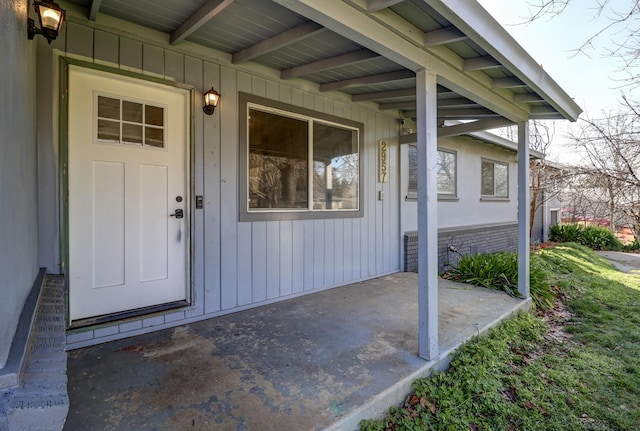 entrance to property with brick siding