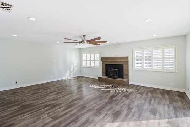 unfurnished living room with recessed lighting, visible vents, dark wood finished floors, and baseboards