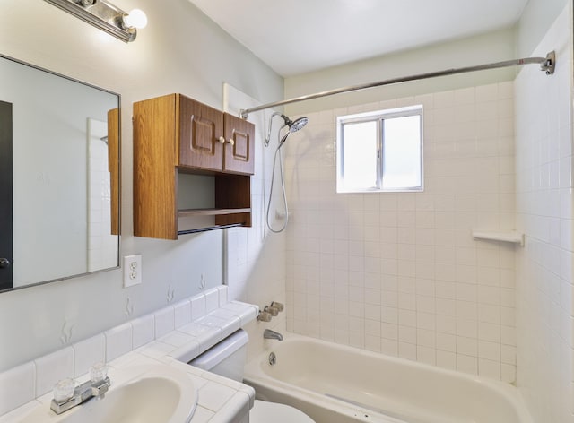 full bathroom featuring tub / shower combination, vanity, and toilet