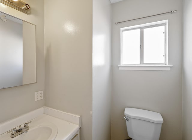 bathroom with toilet and vanity