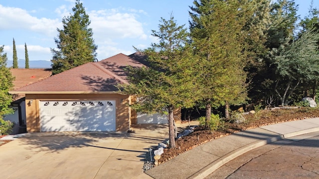 view of front facade with driveway and an attached garage