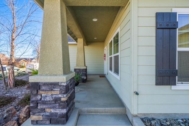 property entrance with covered porch