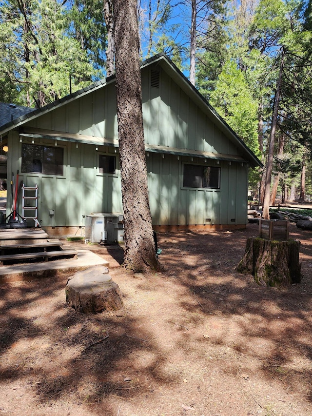 back of property with board and batten siding