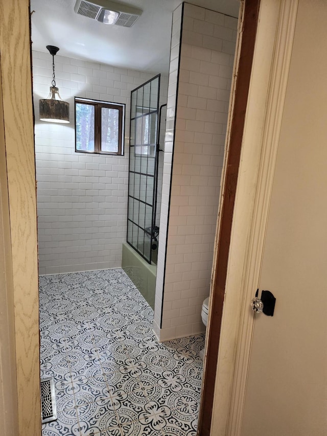 full bath with toilet, tile patterned flooring, and visible vents