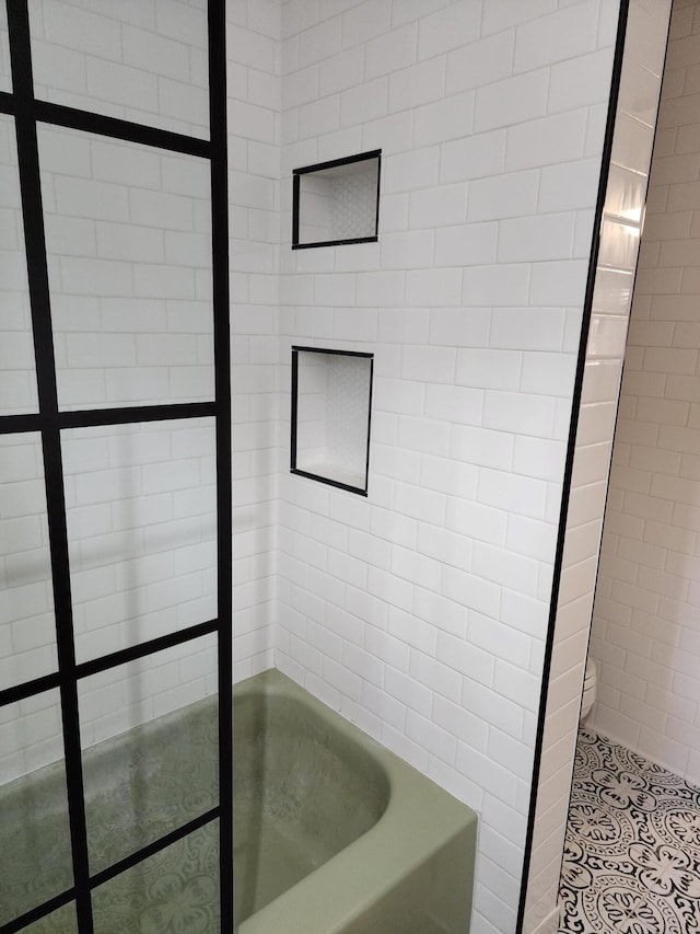 bathroom with a tub to relax in, a shower, toilet, and tile patterned floors