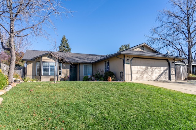 ranch-style house with a front yard, concrete driveway, fence, and an attached garage