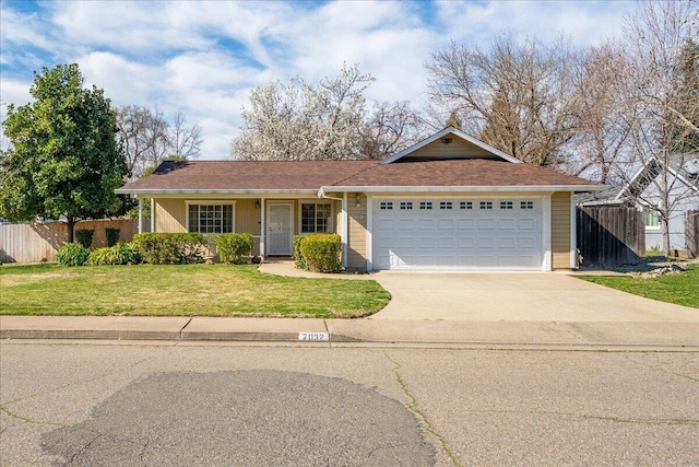 single story home with a garage, driveway, a front lawn, and fence