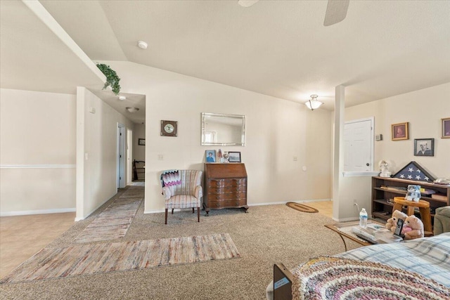 bedroom featuring lofted ceiling, carpet flooring, and baseboards