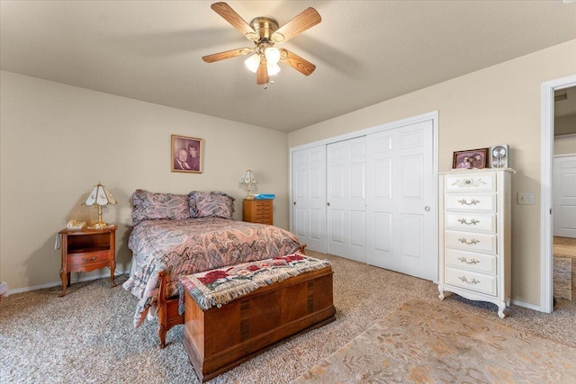 carpeted bedroom with a closet, a ceiling fan, and baseboards