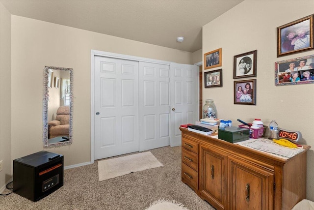 bedroom with a closet and light carpet