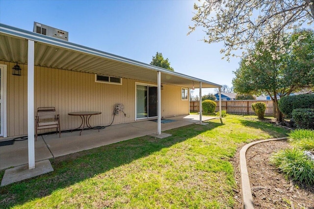 view of yard with fence and a patio