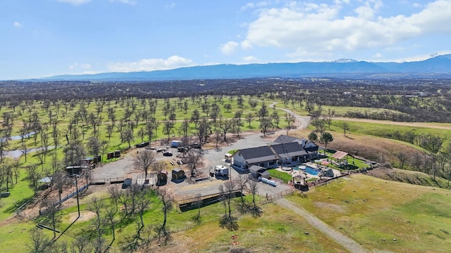 birds eye view of property with a rural view and a mountain view