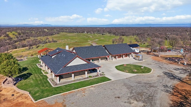 bird's eye view featuring a mountain view and a view of trees