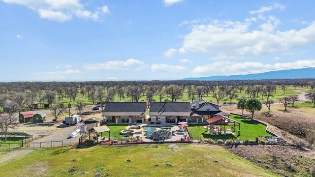 birds eye view of property with a mountain view