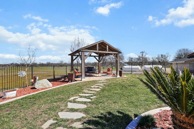 view of yard featuring a fenced backyard, a patio, and a gazebo