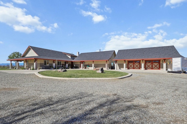 view of front of home featuring an outbuilding and a front yard