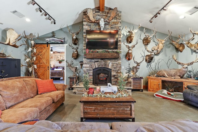 living room with rail lighting, visible vents, and vaulted ceiling with beams