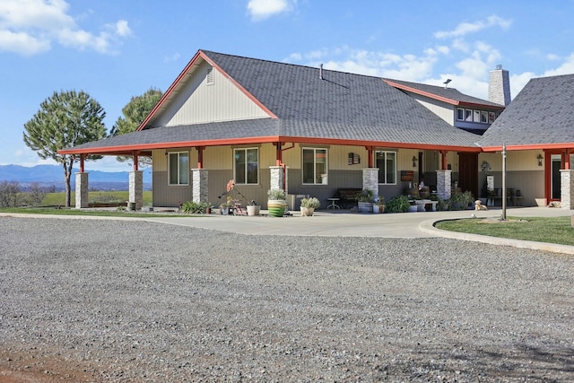 country-style home with concrete driveway and a mountain view