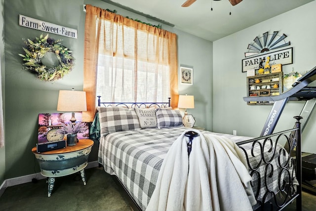 bedroom featuring ceiling fan and baseboards