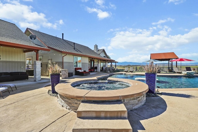 view of pool with fence, a fenced in pool, and a patio