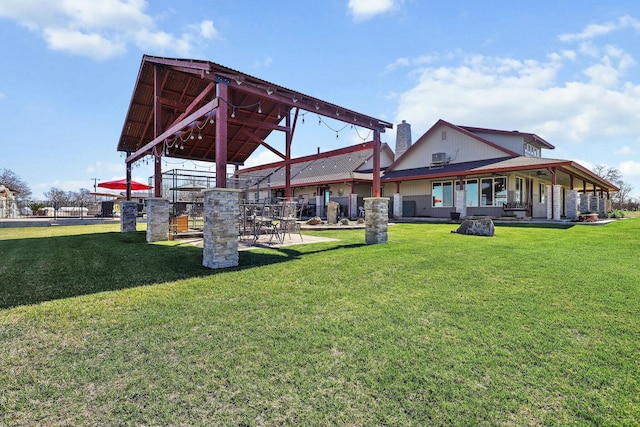 exterior space with a gazebo, a lawn, and fence