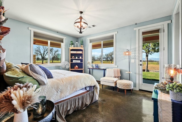 bedroom featuring access to exterior, finished concrete floors, visible vents, and multiple windows