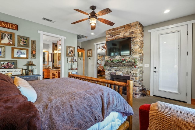 bedroom featuring a stone fireplace, recessed lighting, carpet flooring, a ceiling fan, and visible vents