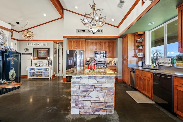 kitchen with visible vents, appliances with stainless steel finishes, brown cabinets, and a sink