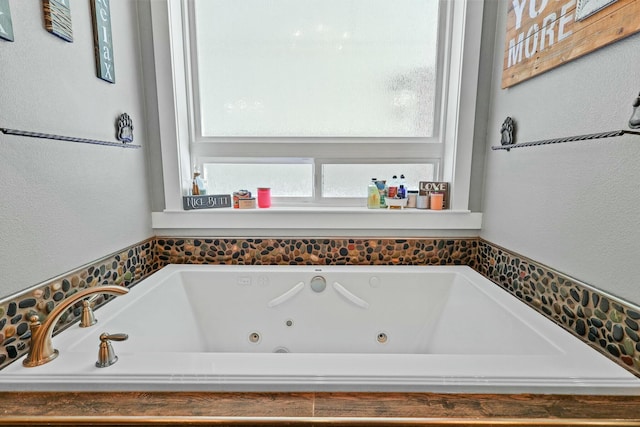 full bathroom featuring a jetted tub