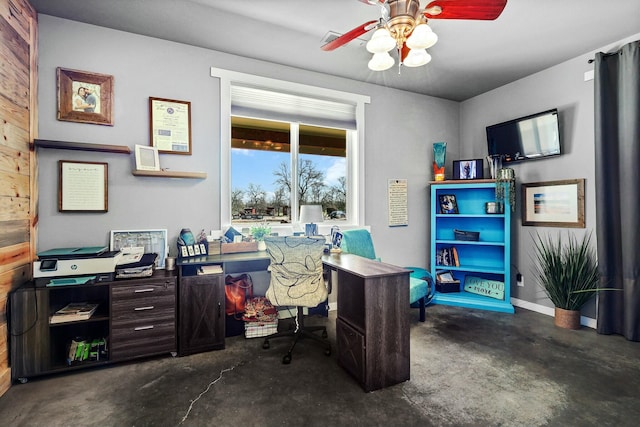 office with concrete flooring, a ceiling fan, and baseboards