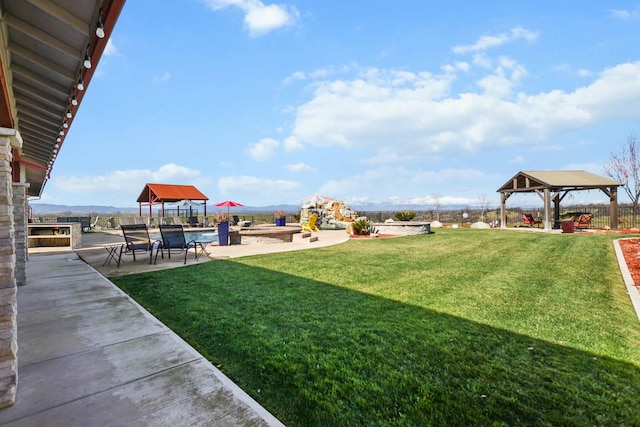 view of yard featuring a patio and a gazebo