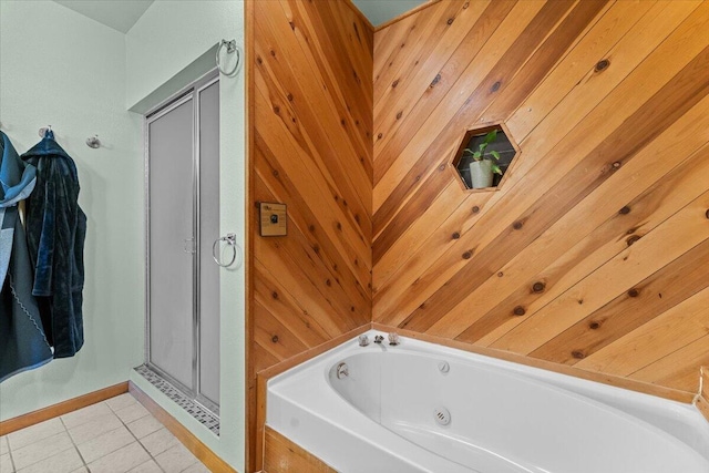 bathroom featuring wood walls, a stall shower, tile patterned flooring, and a jetted tub