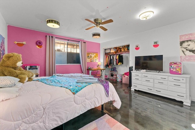 bedroom featuring a ceiling fan, a closet, and concrete floors