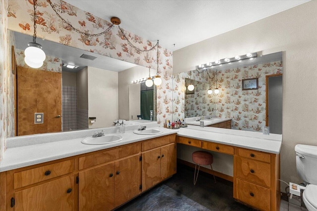 full bathroom with visible vents, a sink, toilet, and wallpapered walls