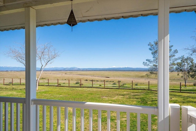 view of yard featuring a rural view and a mountain view