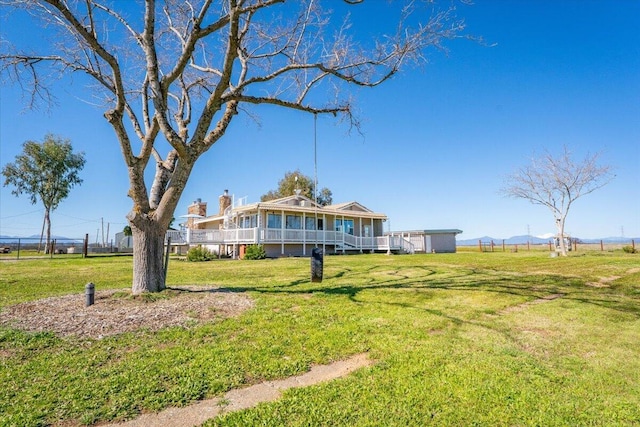 view of front of property with a front lawn and a deck