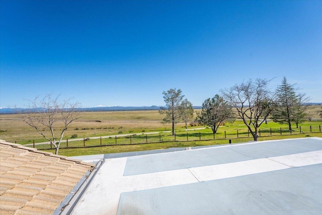 exterior space featuring a rural view and fence