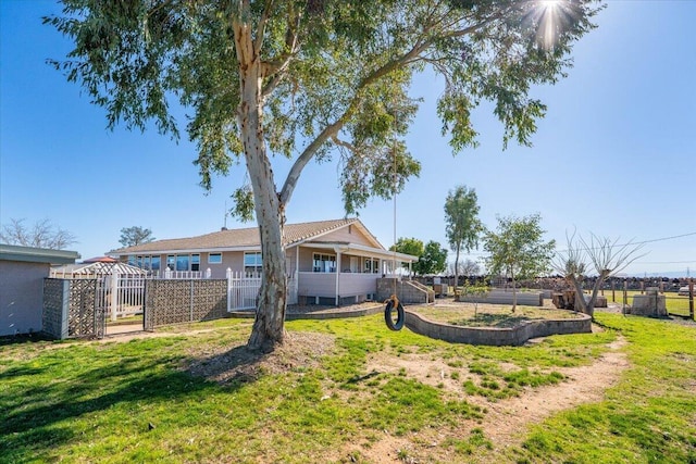 view of yard with a gate and fence