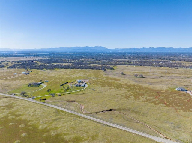 drone / aerial view with a mountain view and a rural view