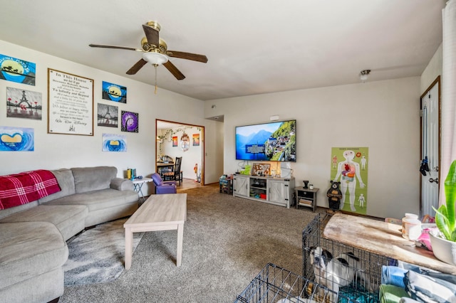 living area featuring ceiling fan and carpet floors