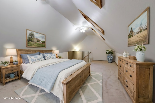 bedroom with light carpet and vaulted ceiling with skylight