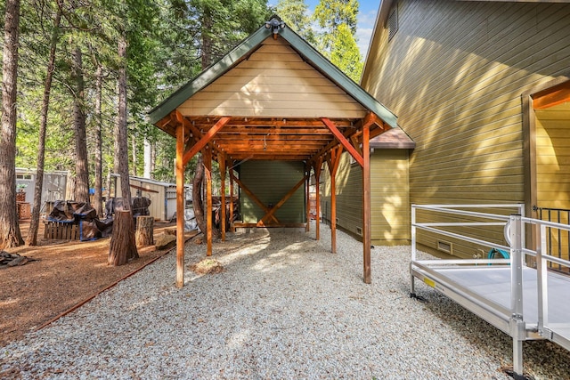 exterior space with driveway and a detached carport