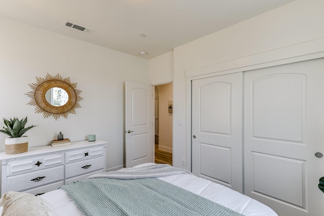 bedroom with visible vents and a closet