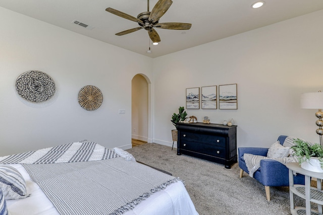 bedroom with baseboards, visible vents, arched walkways, carpet floors, and recessed lighting